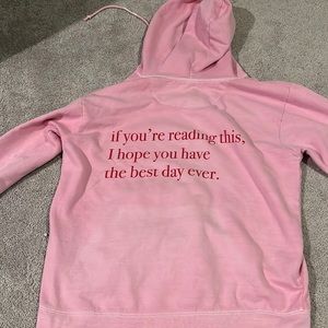 pink sweatshirt with words on the back. from etsy. size small